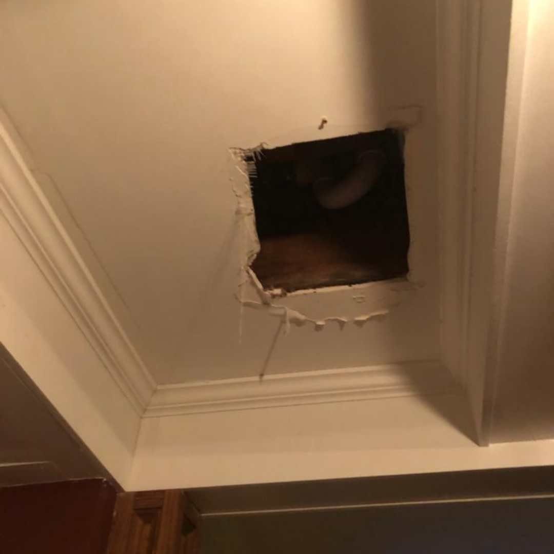 Water-damaged drywall ceiling repair around a vent in a Kansas City metro home