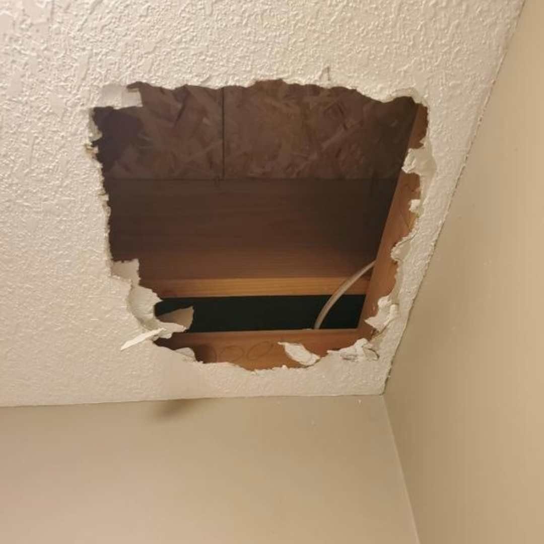 Fist-sized hole in drywall ready for patching, Jackson County, Missouri