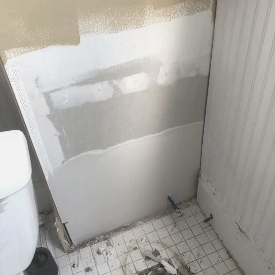 Plumbing access hole patched in a Kansas City, MO kitchen wall