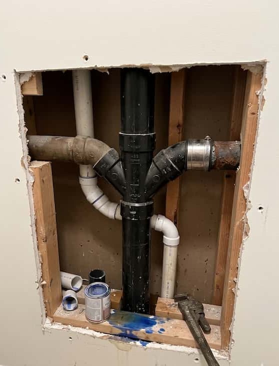 Drywall before repair — large hole in wall